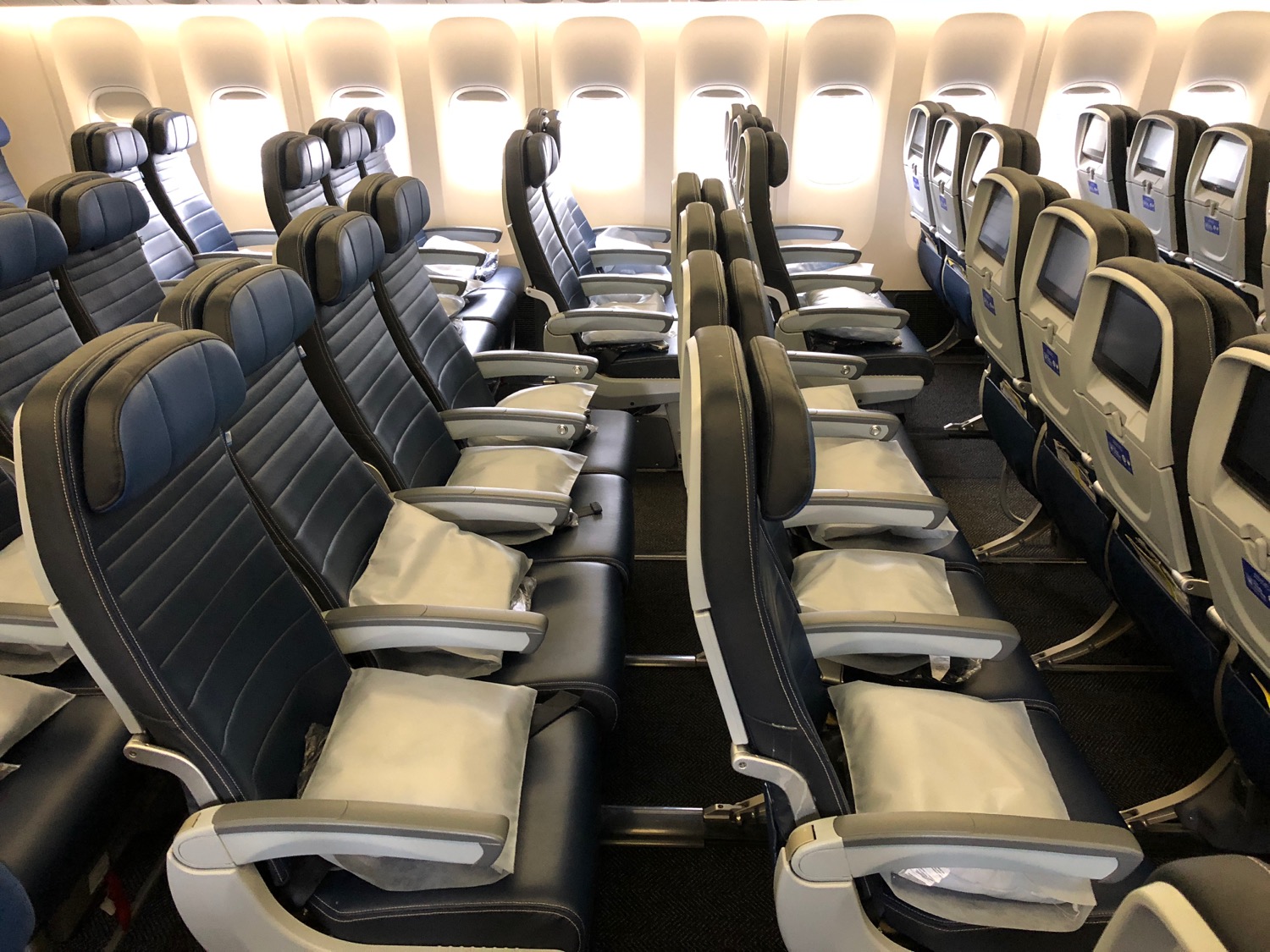 Spacious economy and business class cabin of Boeing 777-300